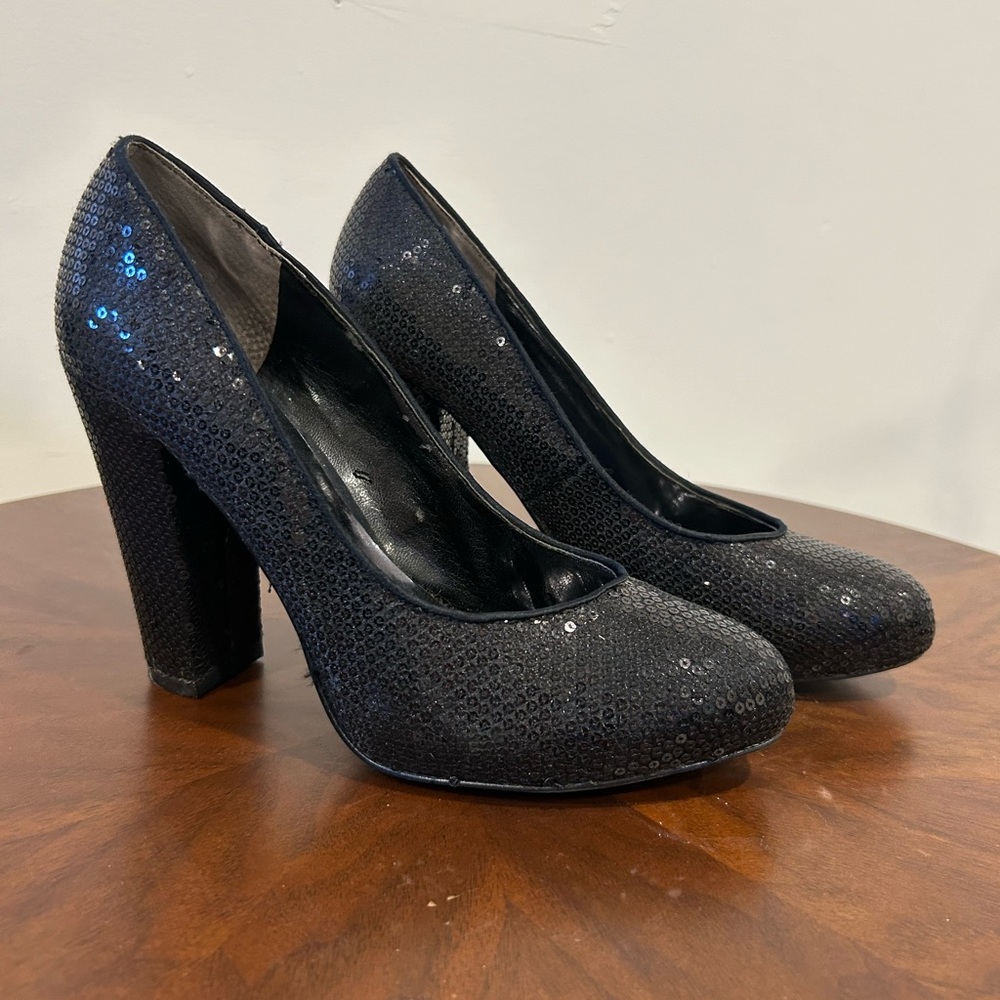 Black sequined platform pumps